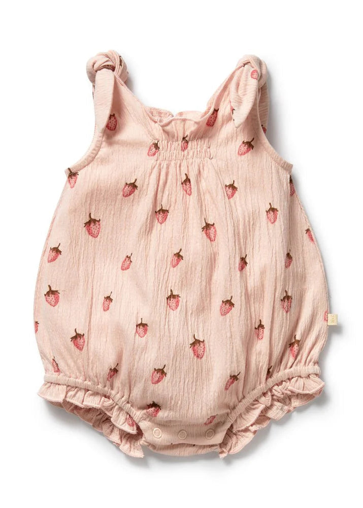 Pink baby romper with strawberry pattern on a white background
