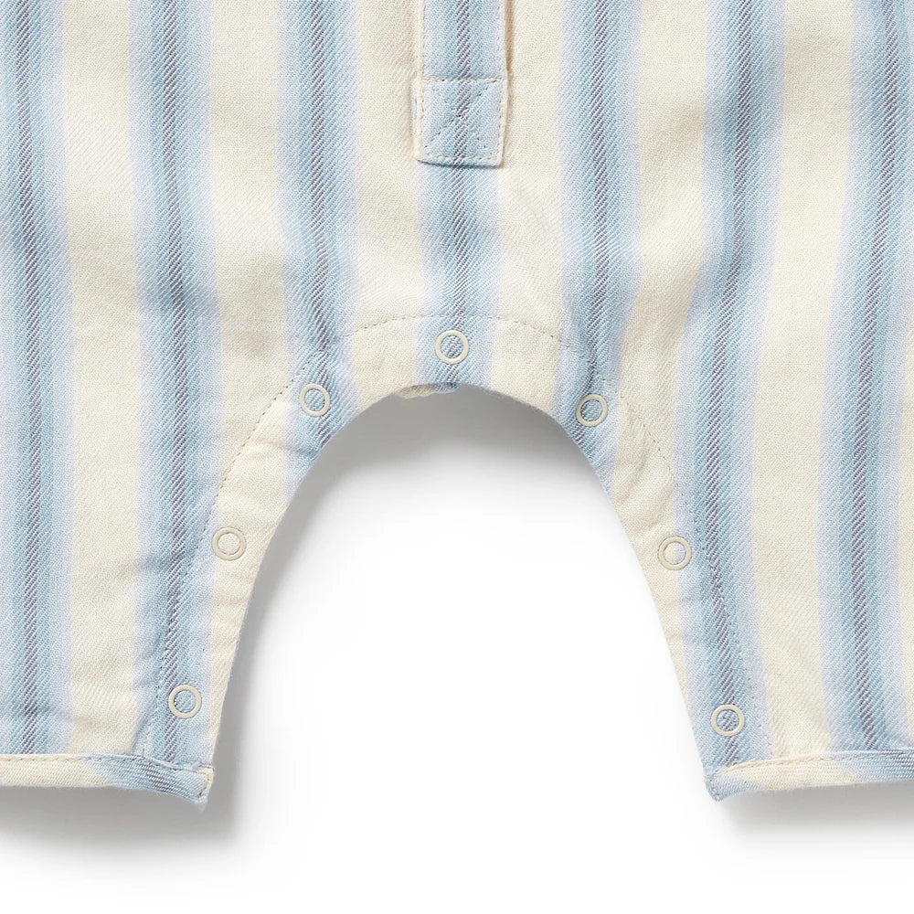 Close-up of a baby romper with blue and white stripes on a white background