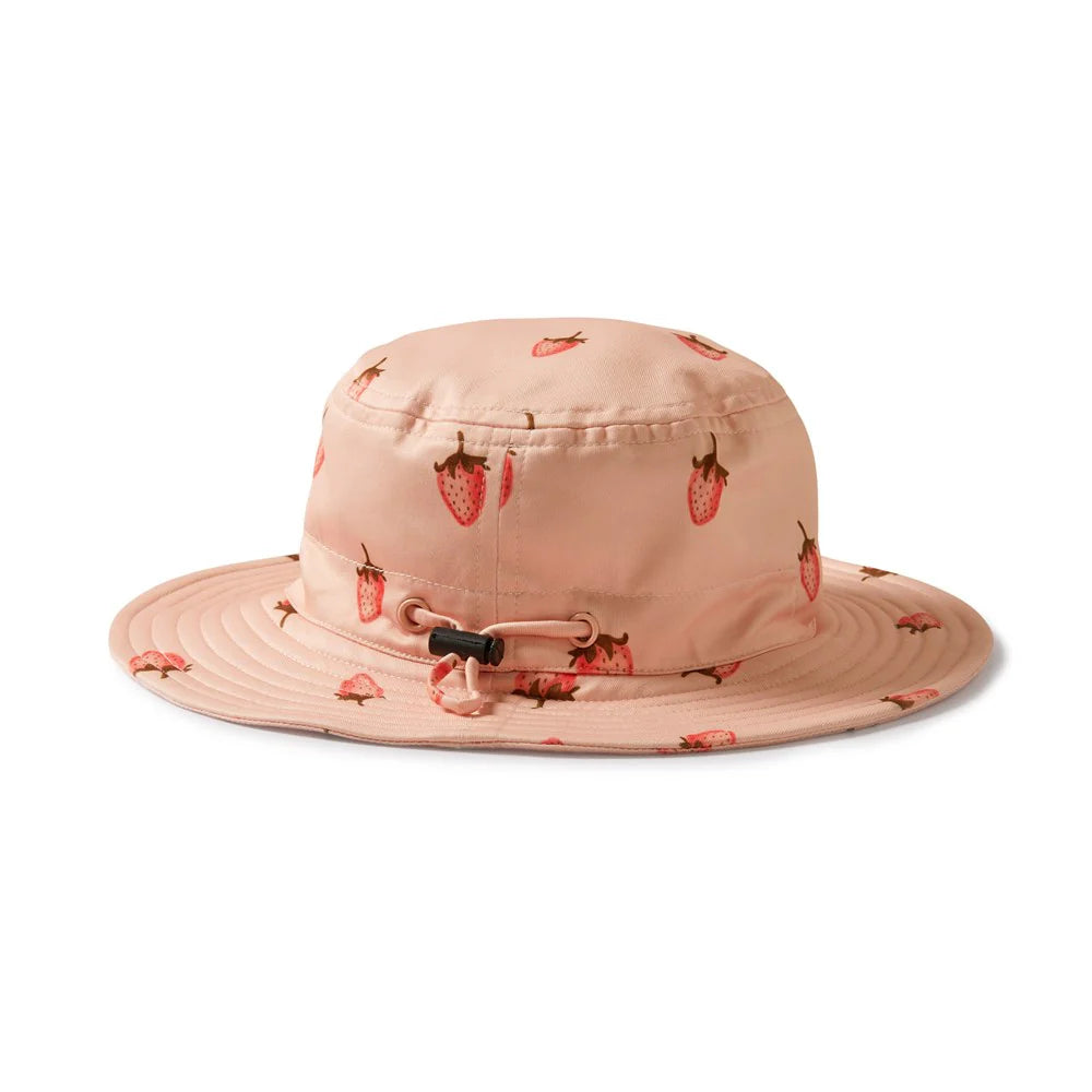Pink bucket hat with strawberry pattern on a white background