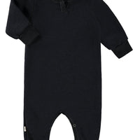 Black baby onesie on a white background