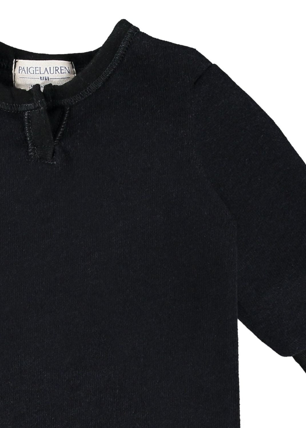 Black sweater with a brand label on a white background