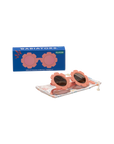 Children's sunglasses with floral design on a display stand and packaging box, featuring the brand 'Babiators'.