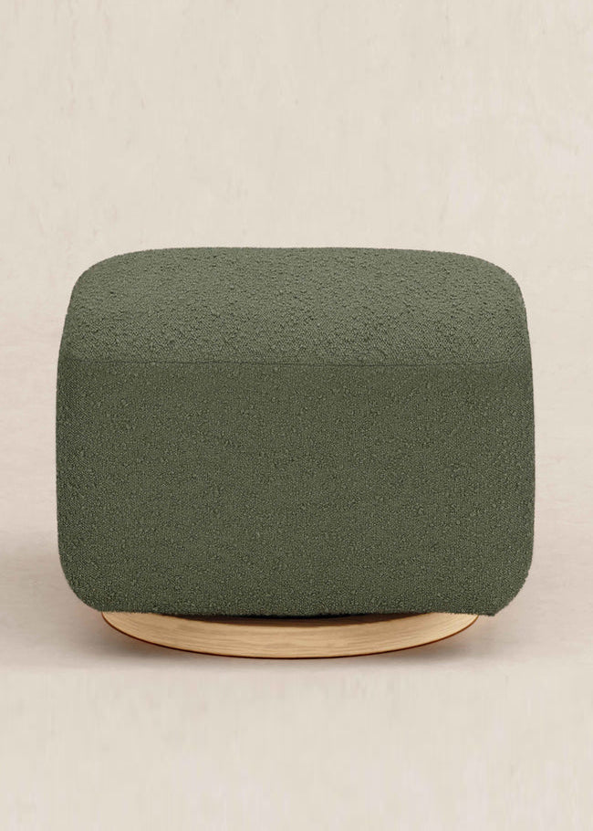 Green ottoman with wooden base on a beige background