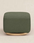 Green ottoman with wooden base on a beige background