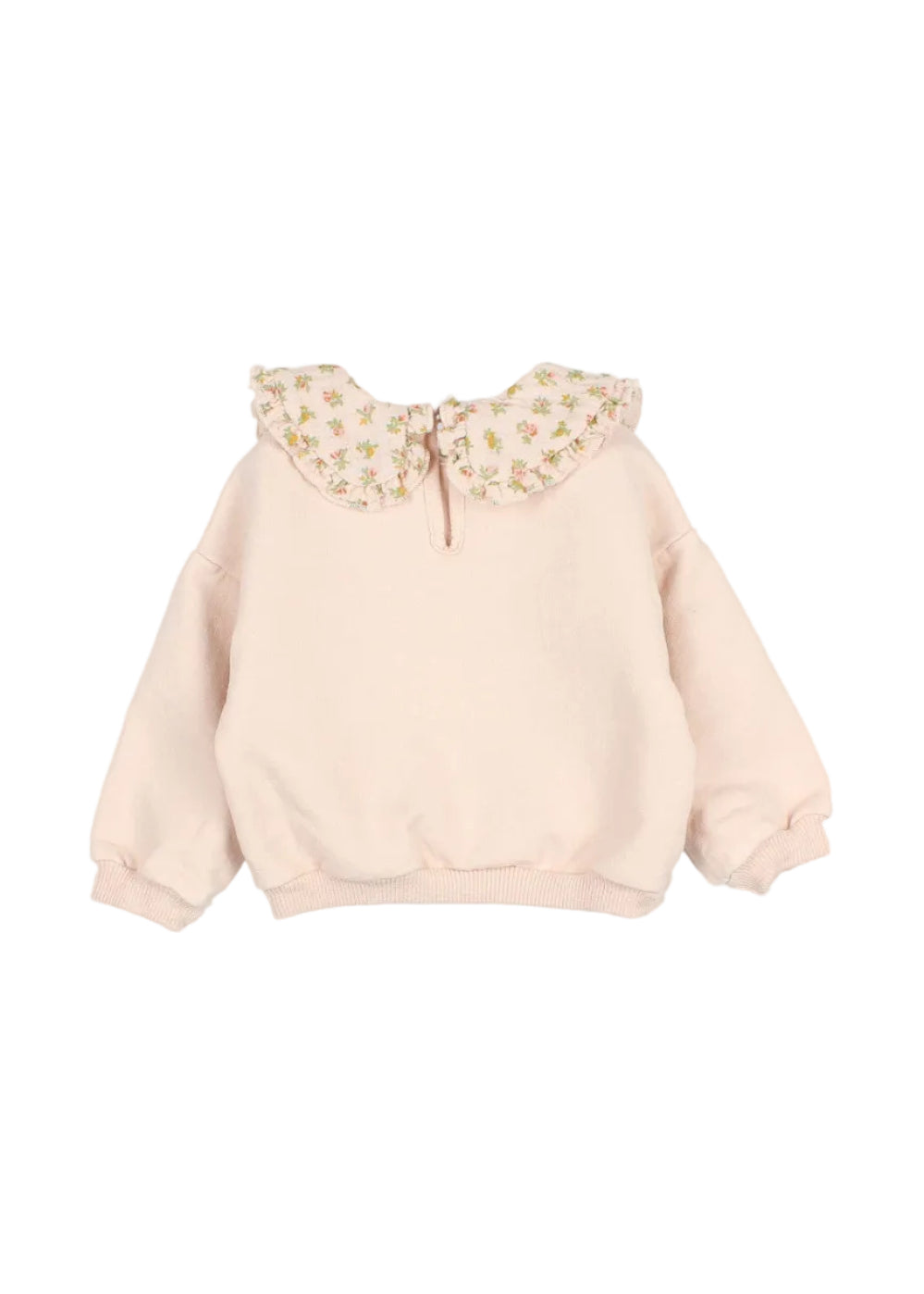 A light pink long-sleeve sweatshirt for a toddler girl, featuring a large ruffled Peter Pan collar decorated with a small yellow and green floral pattern.