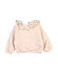 A light pink children's sweatshirt with a large floral-patterned collar, displayed flat against a light gray background.