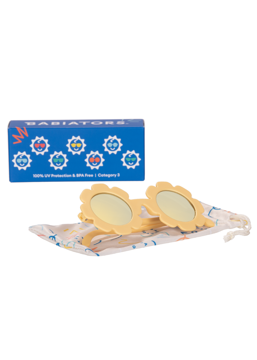 Children's yellow sunglasses with floral design on a white background, featuring the Babiators brand.