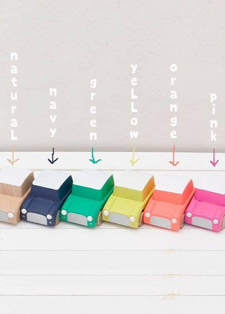 Set of colorful paper boxes labeled with color names on a white background
