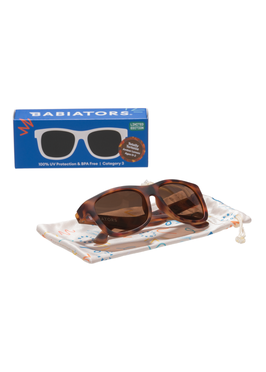 Brown sunglasses with tortoiseshell accents on a white background, featuring Babiators packaging.