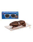 Brown sunglasses with tortoiseshell accents on a white background, featuring Babiators packaging.