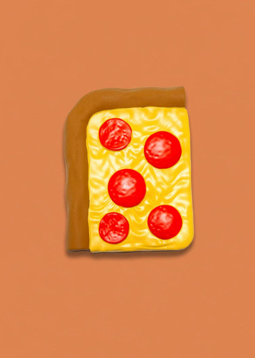 Toy cheese with tomato slices on a brown background
