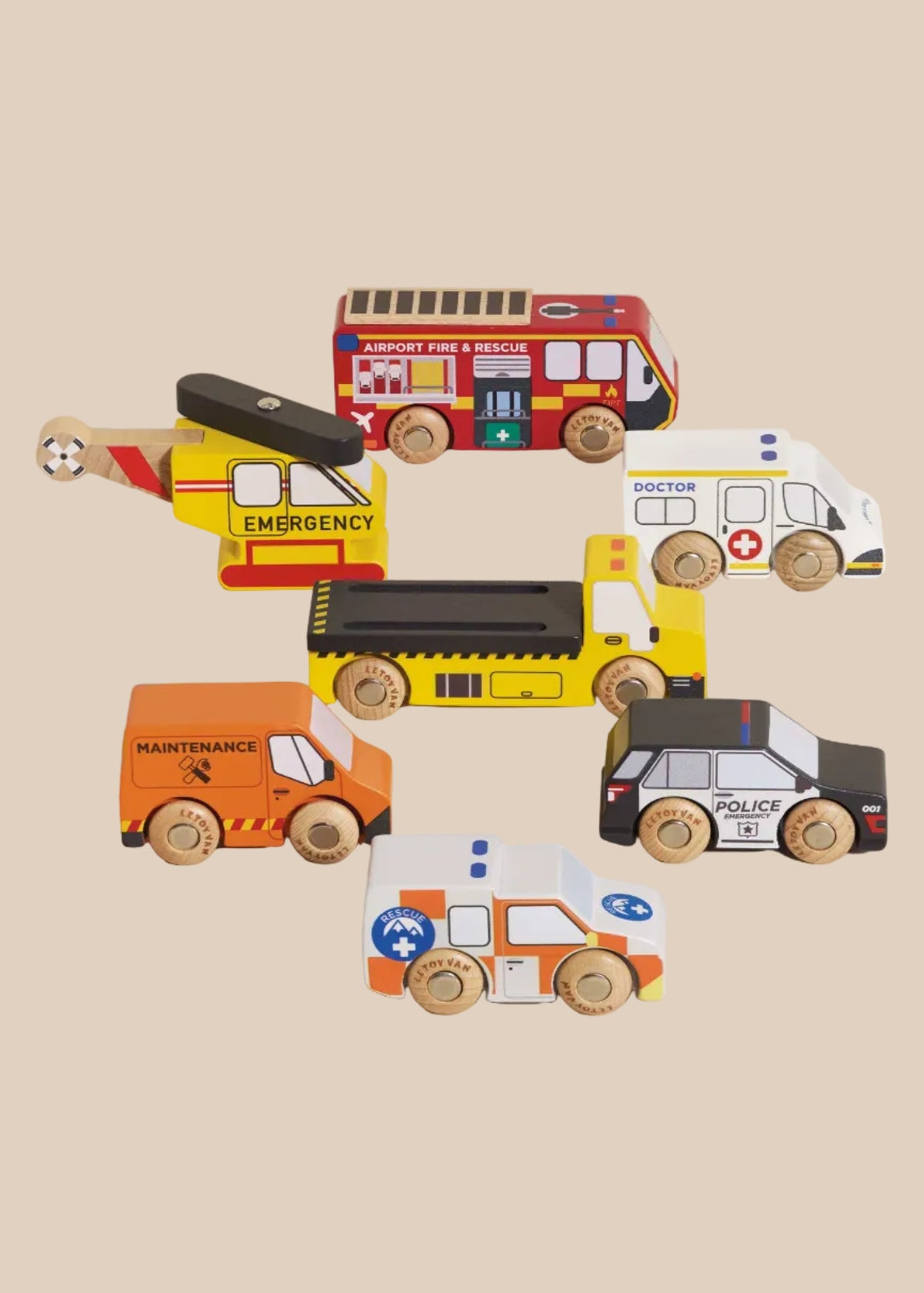 Set of colorful toy vehicles including a fire truck, ambulance, helicopter, and police car on a beige background.