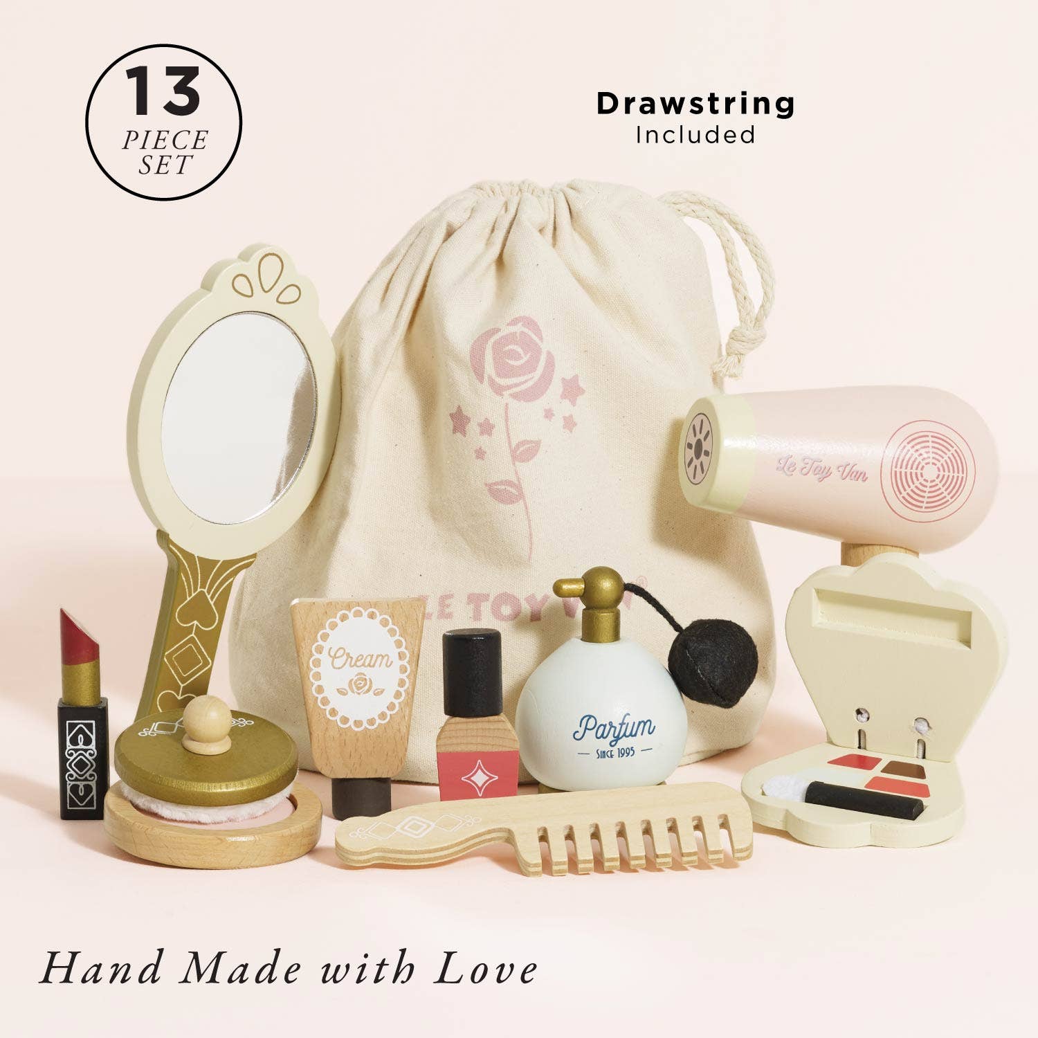Set of makeup and beauty items with a drawstring bag on a light pink background, labeled 'Drawstring Included'.