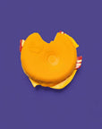 Yellow toy with red accents on a purple background
