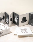 Children's book with animal illustrations on a white surface