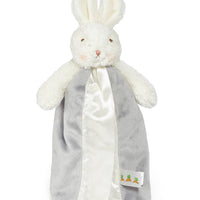White plush bunny with a gray blanket on a white background