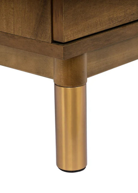 Wooden furniture leg with gold finish on a white background