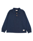 A dark navy blue long-sleeve polo shirt with a three-button placket and small brand labels on the collar and hem, displayed flat against a light off-white background.