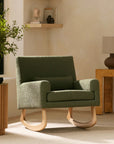 Green armchair in a room with wooden tables and decor