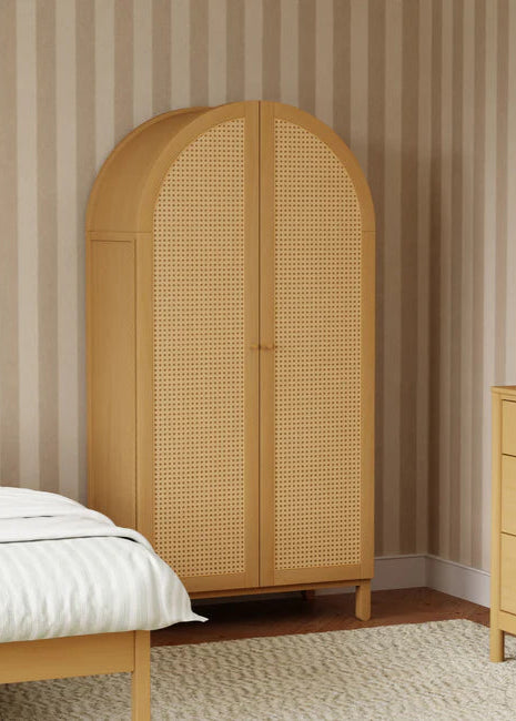 Wooden wardrobe with wicker design in a bedroom setting