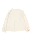 A cream-colored long-sleeve shirt shown from the back, featuring a crew neck, subtle stitched detailing across the upper back, and buttoned cuffs, laid flat against a light gray background.