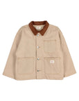 A beige canvas utility jacket with a brown corduroy collar, featuring silver snap buttons and four front patch pockets, laid flat on a light gray background.