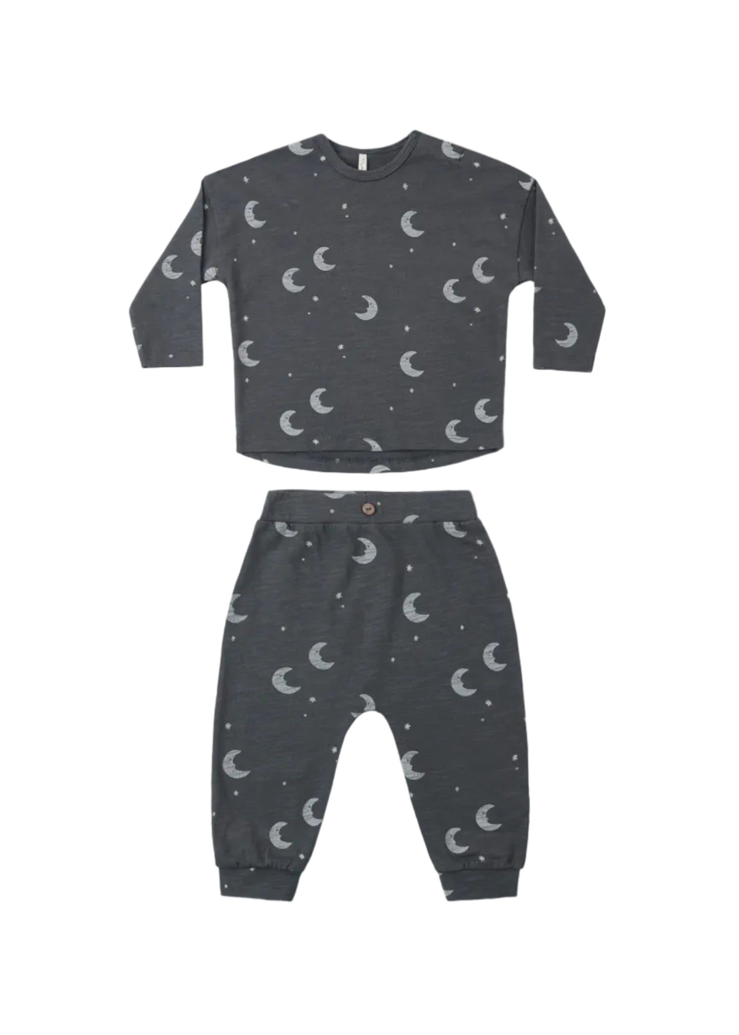 Children's pajama set with moon and star pattern on a white background