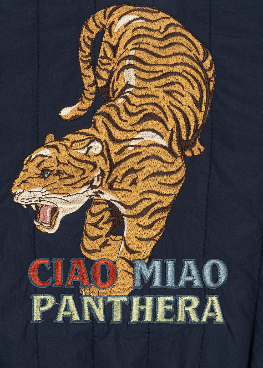 Embroidered tiger design with 'CIAO MIAO PANTHERA' text on a dark background