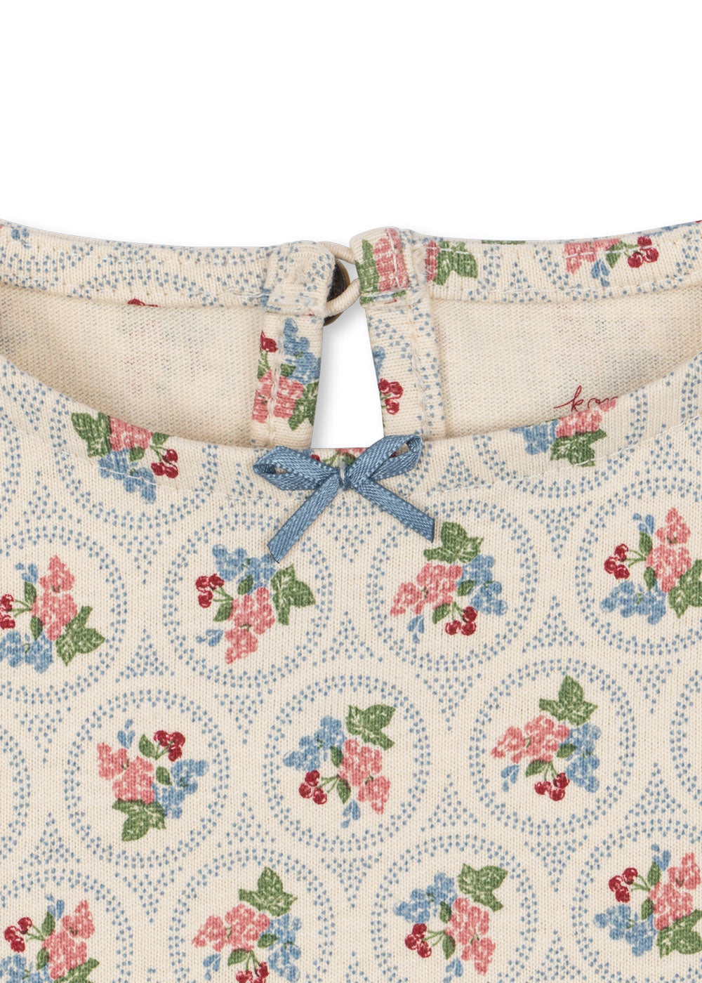 Floral patterned fabric with a blue bow on a white background
