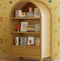 Wooden bookshelf with books and decor against a yellow wallpapered wall.