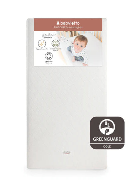 Baby mattress with Babyletto branding and Greenguard Gold certification on a white background