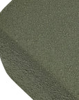 Close-up of a green textured circular object on a white background