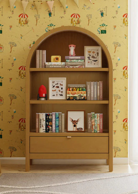Wooden bookshelf with decorative items against a patterned wall.