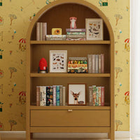 Wooden bookshelf with decorative items against a patterned wall.