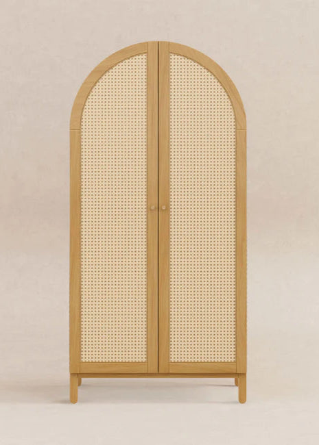 Wooden cabinet with rattan doors on a beige background